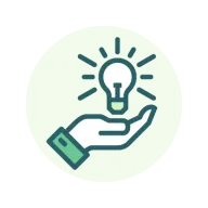 A hand holding a light bulb